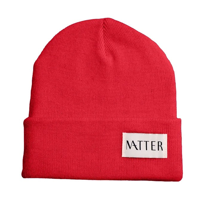 Red knit beanie with turned-up brim and woven Matter label on front