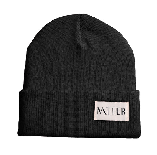 Black knit beanie with turned-up brim and woven Matter label on front