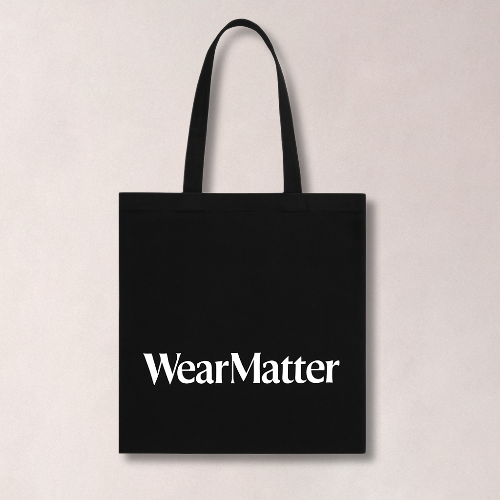 A black tote bag with 'WearMatter' printed in white on the front.