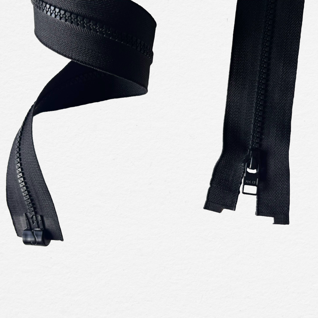 Close-up of a black magnetic zipper on a white background