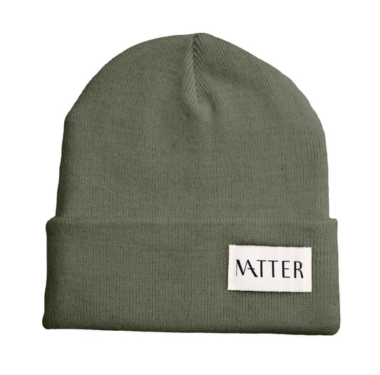Olive green knit beanie with turned-up brim and woven Matter label on front