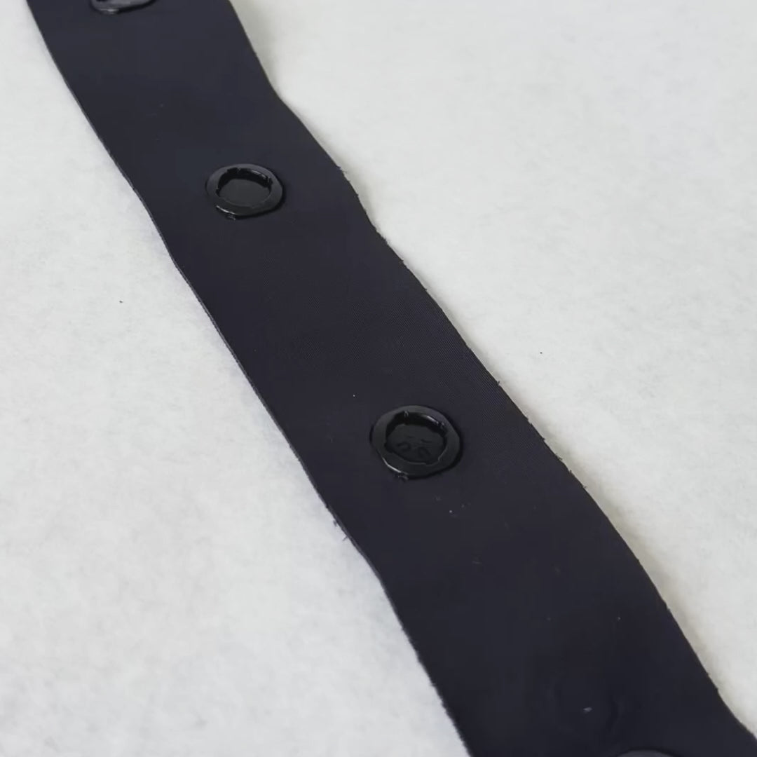 Watch how our adaptive magnetic fastening tape works: waterproof embedded magnets create easy closures for inclusive clothing.